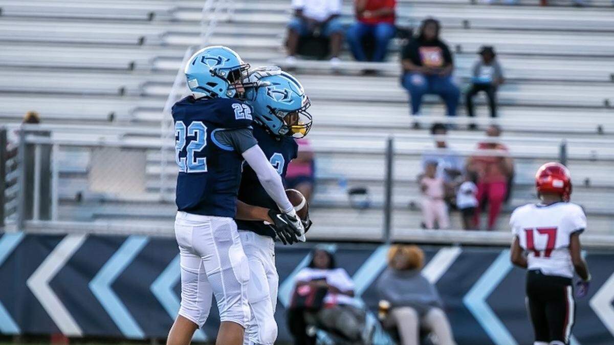 Hopewell celebrates as they pick up a fumble recovery