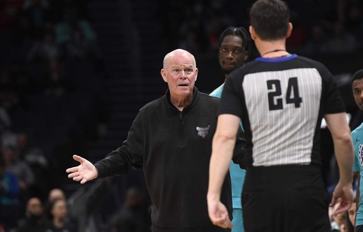  Charlotte Hornets head coach Steve Clifford complains to crew chief Kevin Scott (24)  during the second half against the Chicago Bulls at the Spectrum Center.