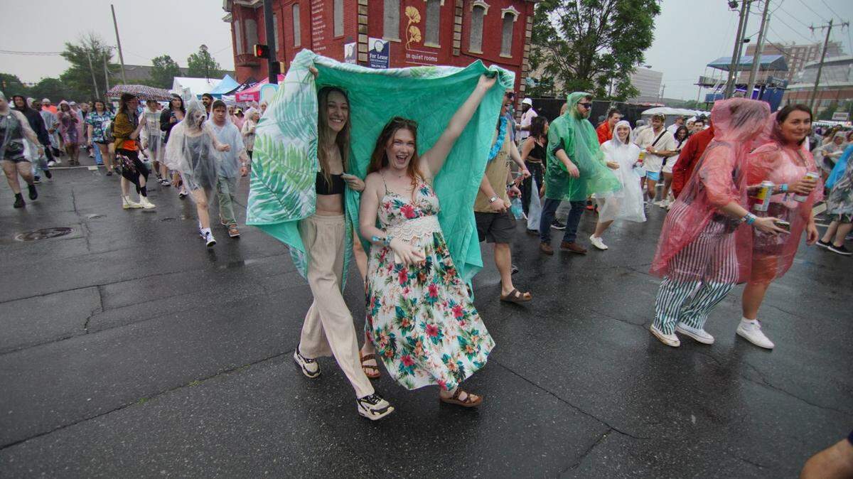 Lovin' Life Music Fest attendees braved the rain last May, on Day two of the uptown Charlotte music festival.