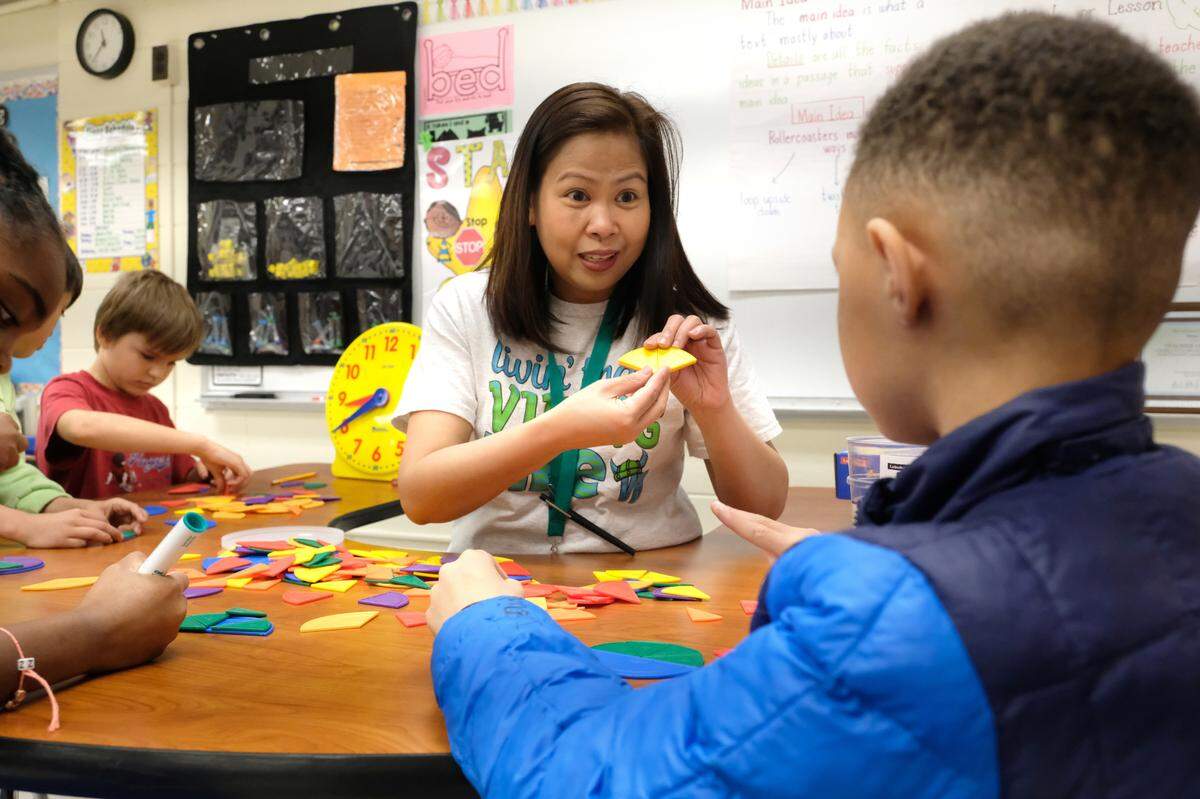 Villa Heights Elementary School Teacher Imee Idjao was named the 2022 CMS Teacher of the Year. Here, she teaches students in her classroom.