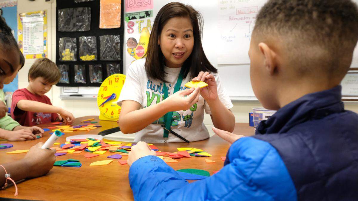 Villa Heights Elementary School Teacher Imee Idjao was named the 2022 CMS Teacher of the Year. Here, she teaches students in her classroom.