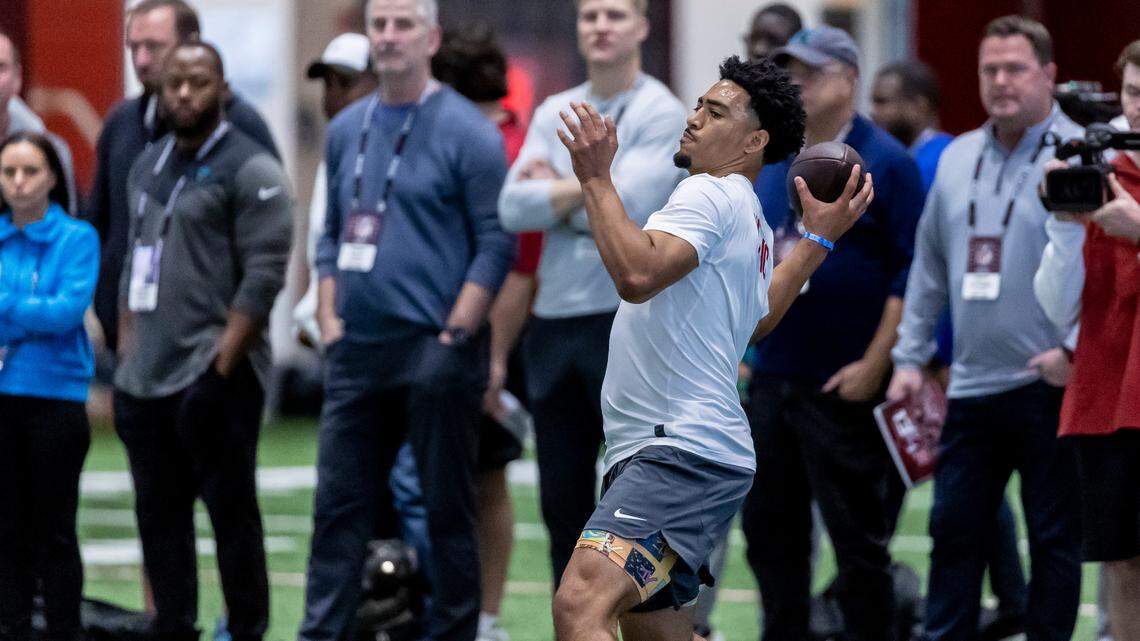 Former Alabama quarterback Bryce Young works in position drills at Alabama’s NFL pro day, Thursday, March 23, 2023, in Tuscaloosa, Ala. Looking on in the background are a host of Carolina Panthers reps including offensive coordinator Thomas Brown, senior assistant Jim Caldwell, head coach Frank Reich, quarterbacks coach Josh McCown, owner David Tepper and general manager Scott Fitterer. (AP Photo/Vasha Hunt)