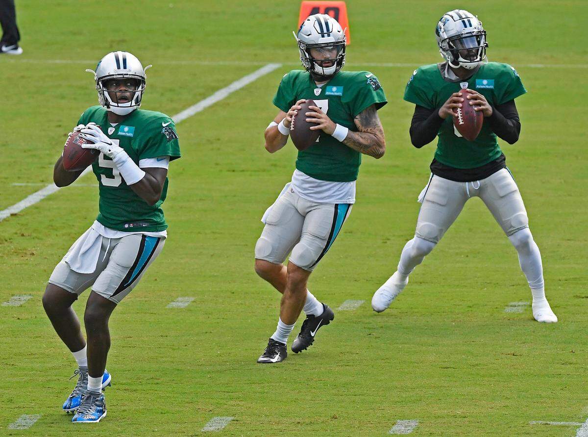 Carolina Panthers quarterback Teddy Bridgewater (5), quarterback Will Grier (7), and quarterback P.J. Walker (6) drop back to pass during practice at Bank of America Stadium during training camp on Saturday, August 22, 2020.