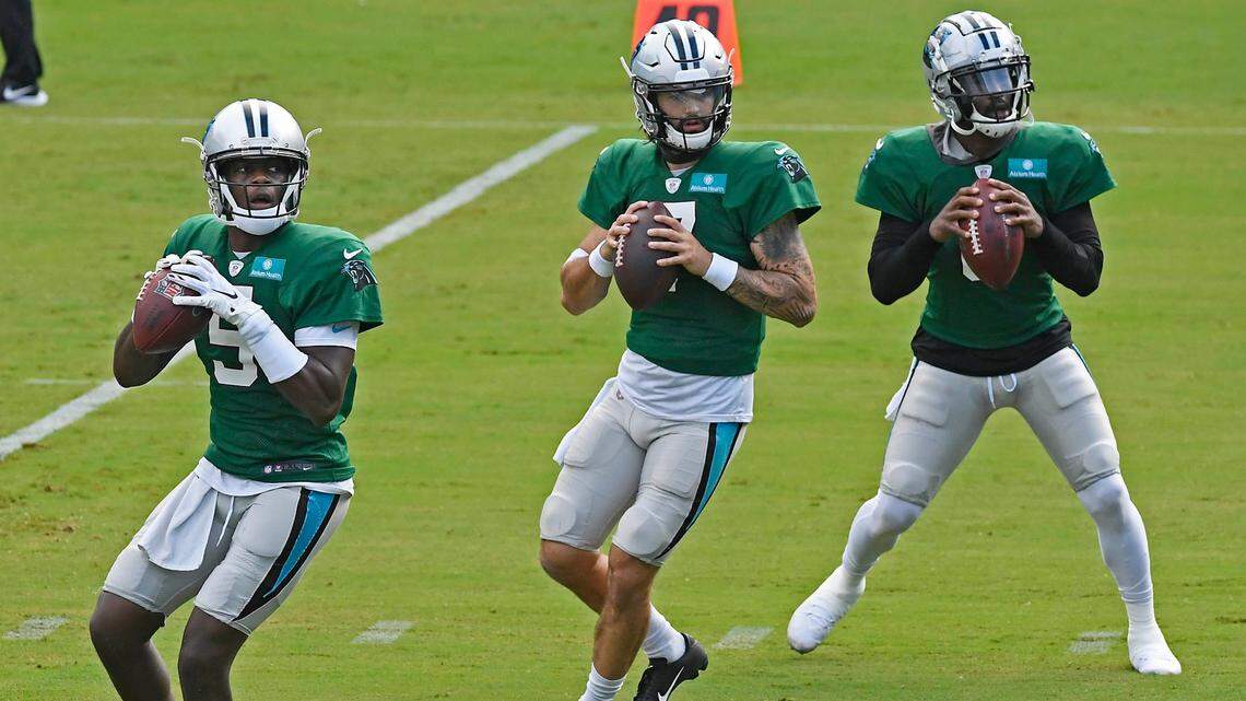 Carolina Panthers quarterback Teddy Bridgewater (5), quarterback Will Grier (7), and quarterback P.J. Walker (6) drop back to pass during practice at Bank of America Stadium during training camp on Saturday, August 22, 2020.