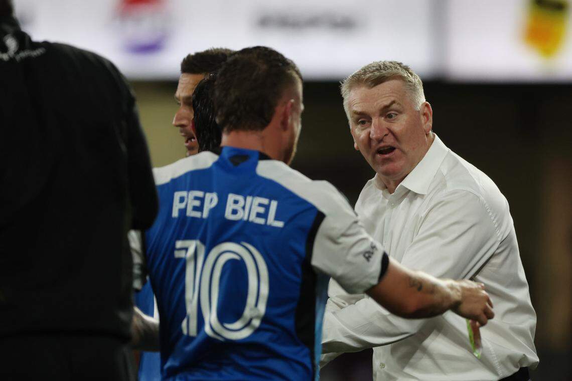 Nov 9, 2024; Orlando, Florida, USA; Charlotte FC head coach Dean Smith talks with midfielder Pep Biel (10) in the second half against the Orlando City in a 2024 MLS Cup Playoffs Round One match at Inter&Co Stadium.