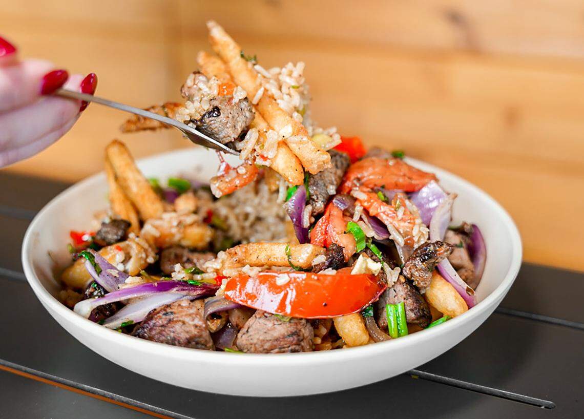 The Lomo Saltado is marinated sirloin, onions, tomatoes and cilantro with Jasmine rice and French fries.