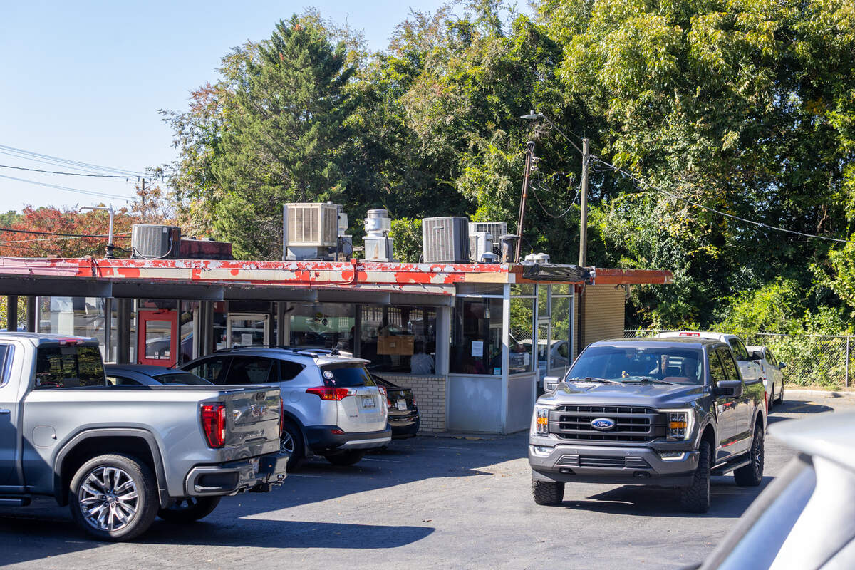 Cars pull up to the stalls to order at Bar-B-Q King on Wilkinson Boulevard in Charlotte.