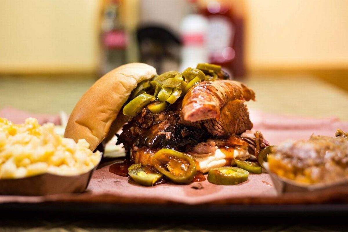 A rather giant BBQ sandwich is shown at The Smoke Pit Restaurant Concord location.