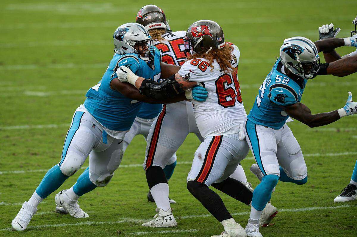 Carolina Panthers defensive tackle Derrick Brown (95) play defensive against Tampa Bay Buccaneers center Ryan Jensen (66) at Raymond James Stadium on Sunday, September 20, 2020, in Tampa Bay, Florida.