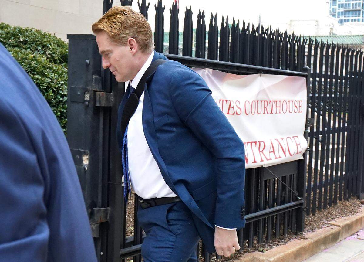 Greg Lindberg enters the federal courthouse in Charlotte during his bribery trial. He and business associate John Gray will be sentenced in Charlotte on Aug. 19.