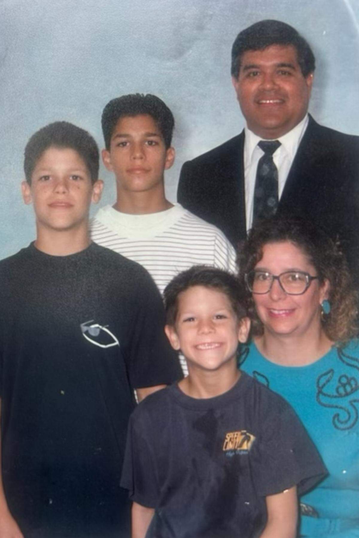 An undated photo of Panthers head coach Dave Canales and his family. His father Isaac (back right, standing) and mother Ritha (bottom right) raised three boys in California - oldest brother Josh (white shirt), middle child Dave (standing, black shirt) and youngest brother Coba (seated in front).