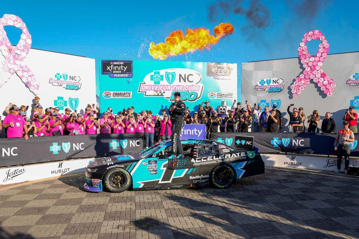 Oct 7, 2023; Concord, North Carolina, USA; NASCAR Xfinity Series driver Sam Mayer (1) celebrates his win during the Drive for the Cure 250 at Charlotte Motor Speedway Road Course.