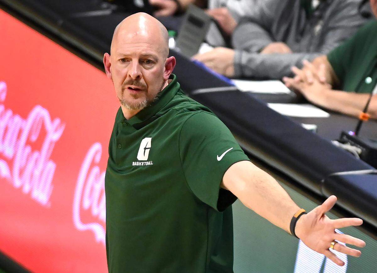 Charlotte 49ers head coach Aaron Fearne questions a call during action against the Davidson Wildcats on Wednesday, November 29, 2023.
