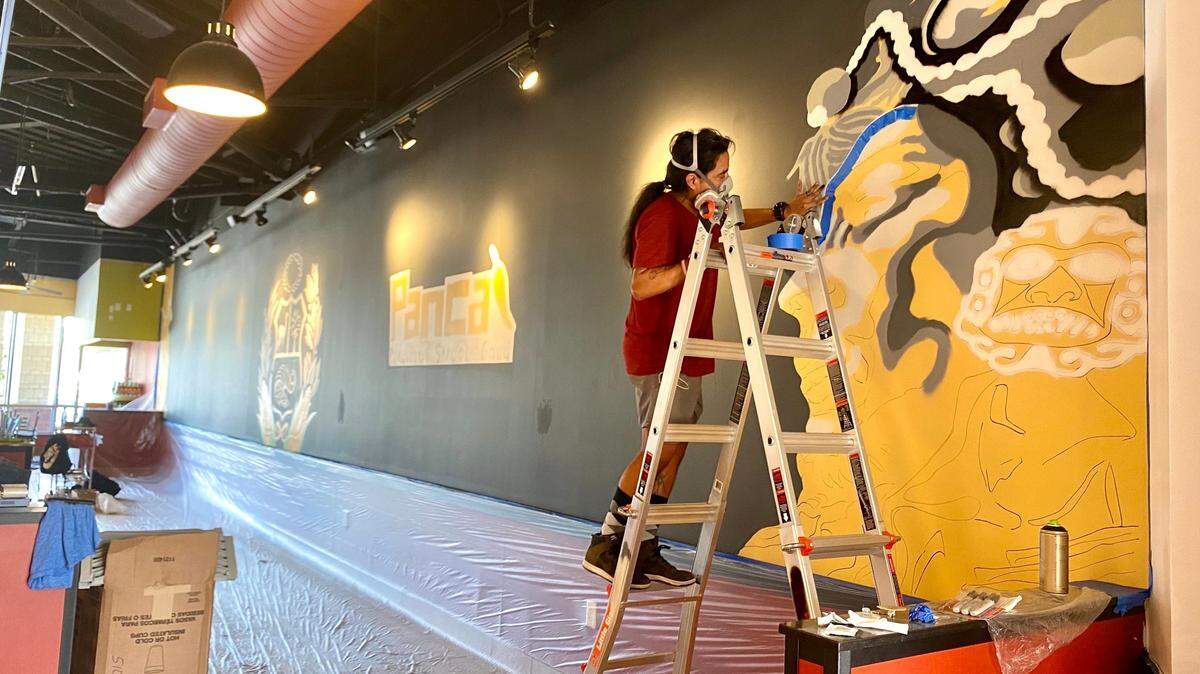 Charlotte artist Juan Tresierra, a native of Peru, painted a mural inside Panca Peruvian to give guests the feeling of being transported to the country.