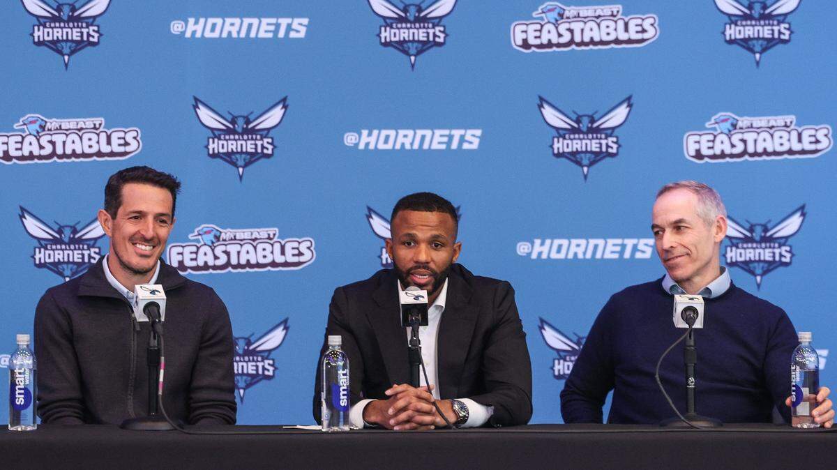 Charlotte Hornets co-chairmen Gabe Plotkin, left, and Rick Schnall, right, announce Jeff Peterson, center, as the team’s executive vice president of basketball operations during a press conference at Spectrum Center on Wednesday, March 6, 2024. Peterson becomes the organization’s chief basketball decision-maker while also being responsible for leading the team’s day-to-day basketball operations.