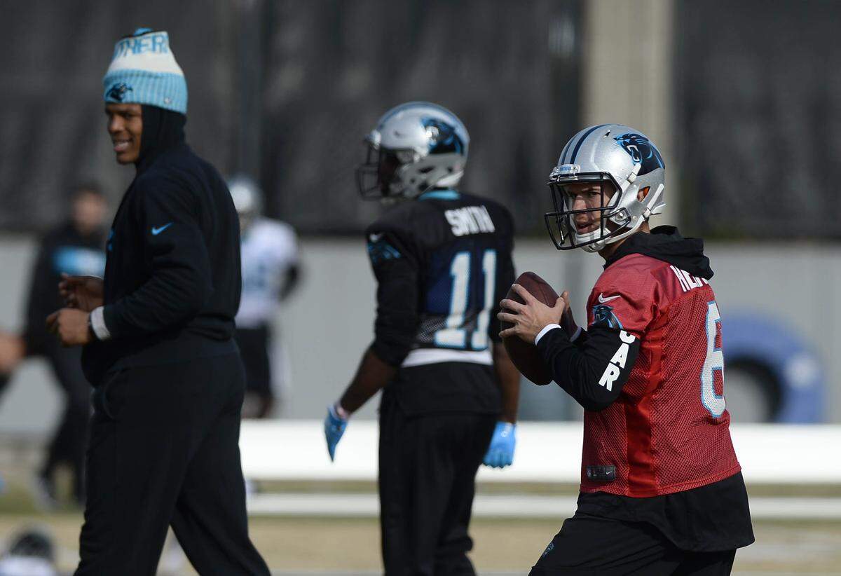 Carolina Panthers quarterback Taylor Heinicke (6) warms up as quarterback Cam Newton (1) looks on during practice on Wednesday, December 19, 2018. The Carolina Panthers announced today that Newton will sit for the remaining two games of the season.