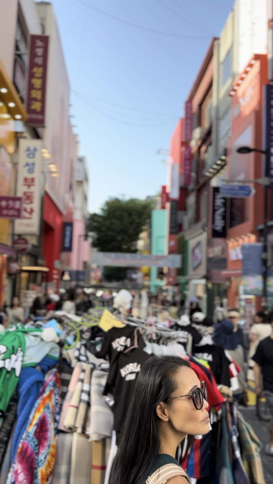 Katie, a fellow Korean adoptee who Théoden Janes met in Seoul, photographed in the middle of the bustling Myeong-dong shopping district on their first full day in Seoul last month.