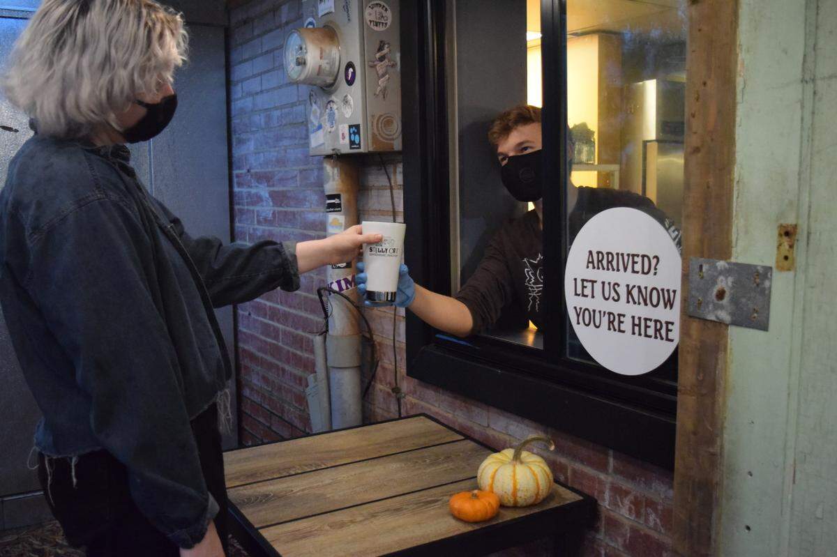 Smelly Cat Coffeehouse & Roastery has two walk-up windows: one to place your order and another to pick it up.