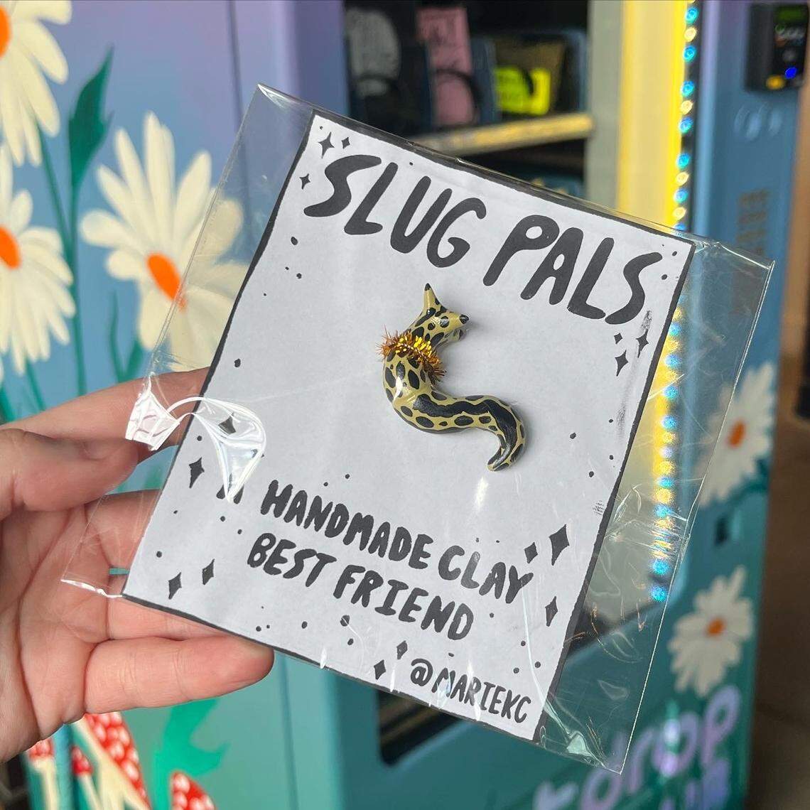 Charlotte artist KC Marie’s “Slug Pal” shrunk down for art vending machine size in breweries around Charlotte.