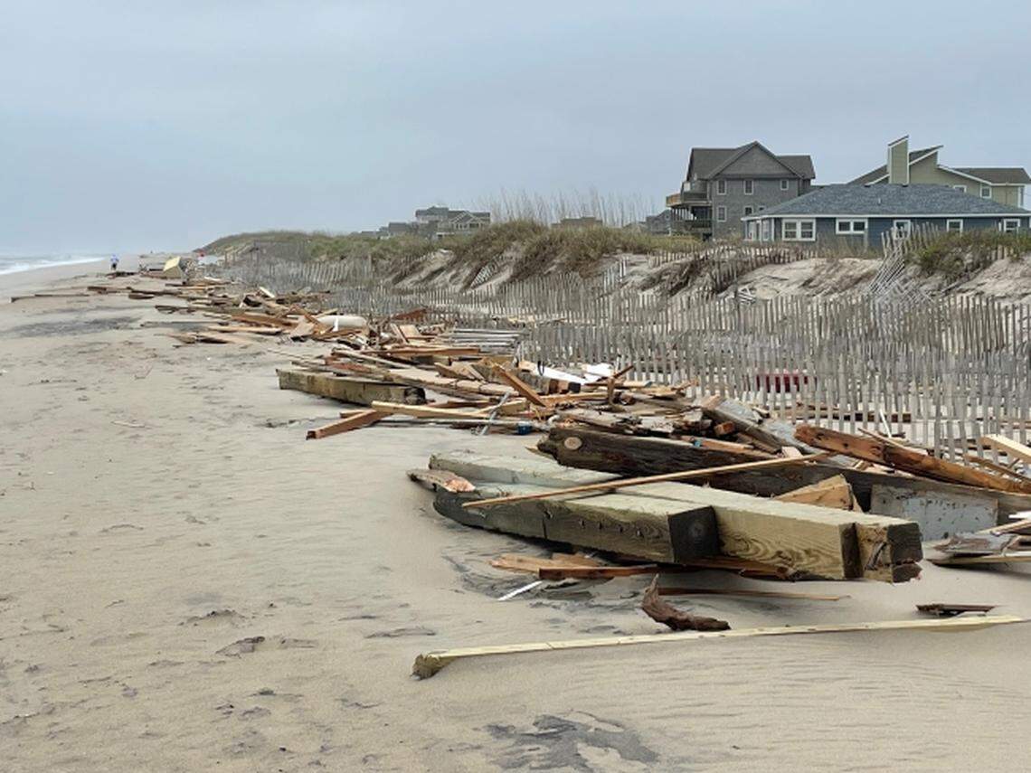 A photo of debris strewn along the shore after two homes collapsed May 10, 2022 in Rodanthe on the N.C. Outer Banks.