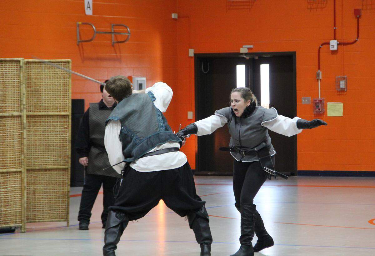 Members of Free Reign Theatre performed at Andrew Jackson Middle School earlier this year. This is scene from “They Fight,” a compilation of the best battles, brawls and sword fights from Shakespeare. Battling it out are Katie Bearden (Tybalt) and Robert Brafford (Mercutio) from Romeo & Juliet. Free Reign’s latest production, “Lear,” opens this week in Charlotte.