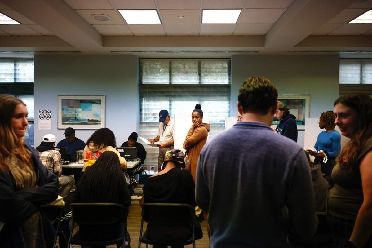 Voters line up at Charlotte Mecklenburg Library at University City to cast their ballot on Tuesday, Nov. 5, 2024.