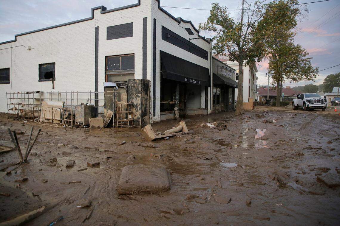 A damaged building in Biltmore Village near downtown Asheville, N.C. is surrounded by mud Thursday, Oct. 3, 2024
