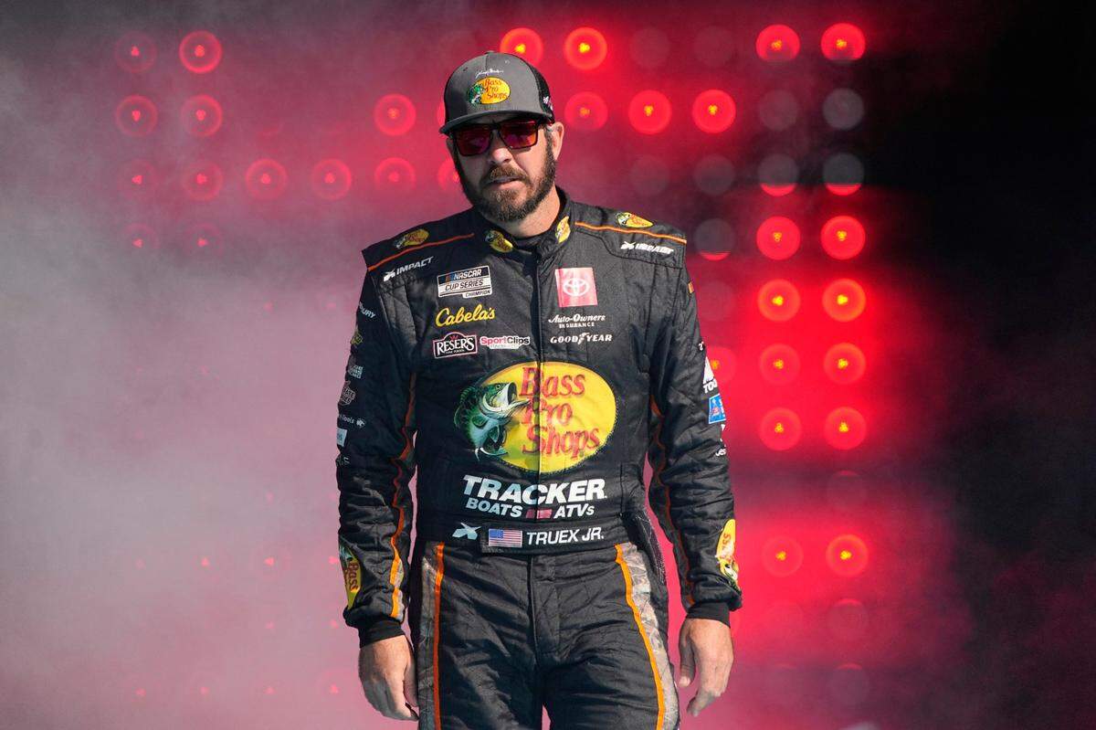 Martin Truex Jr. is introduced to the fans before a NASCAR Cup Series auto race on Sunday, Nov. 7, 2021, in Avondale, Ariz. (AP Photo/Rick Scuteri)