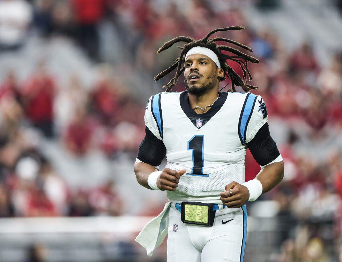 Carolina Panthers Cam Newton runs onto the field before the game against the Arizona Cardinals at the State Farm Stadium in Glendale AZ, on Sunday, November 14, 2021.