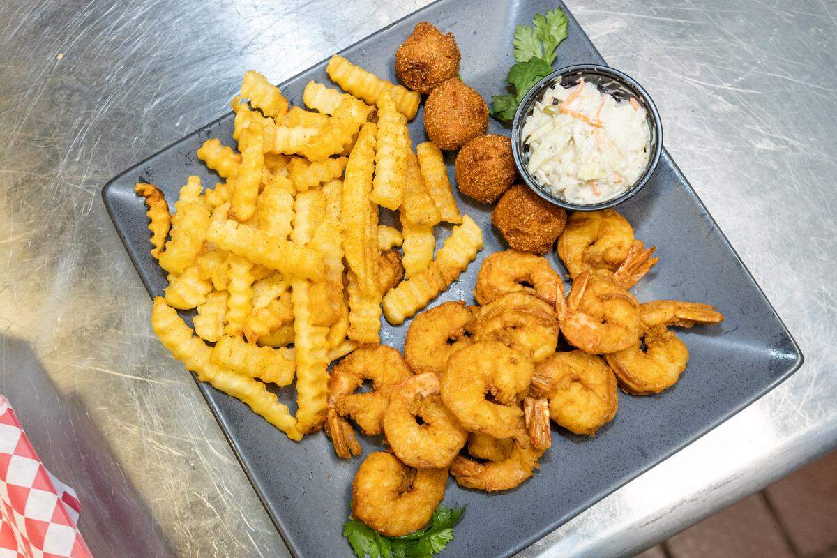 A shrimp platter with fries, hushpuppies and coleslaw at Bryant Seafood Market.