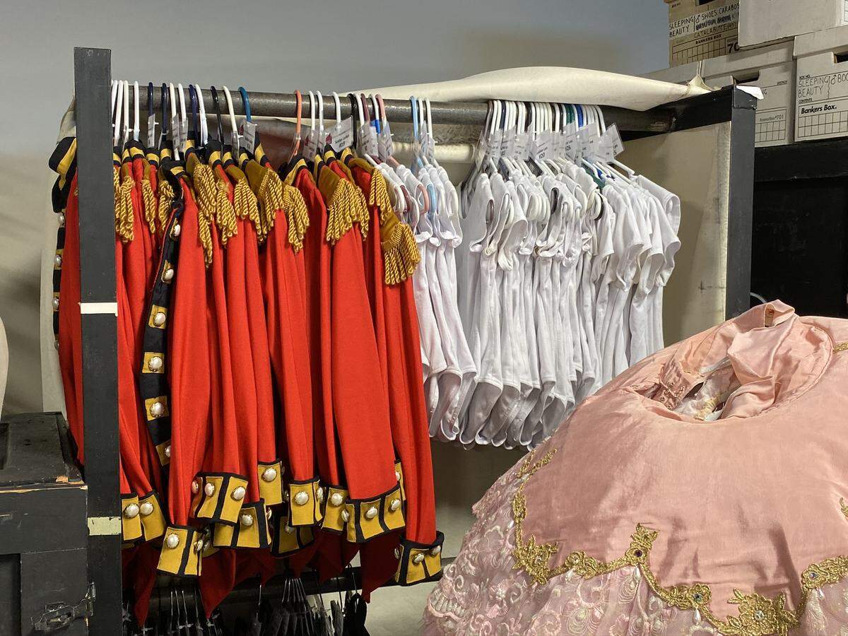 Children’s Nutcracker soldier costumes await transport to the Blumenthal Performing Arts Center in one of approximately 10 gondolas, or rolling wardrobe boxes.