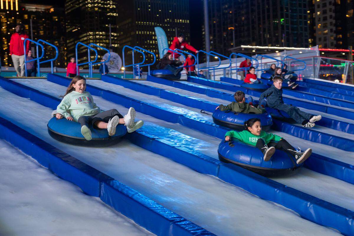 Snow tubing at Light the Knights Festival at Truist Field in Uptown Charlotte.