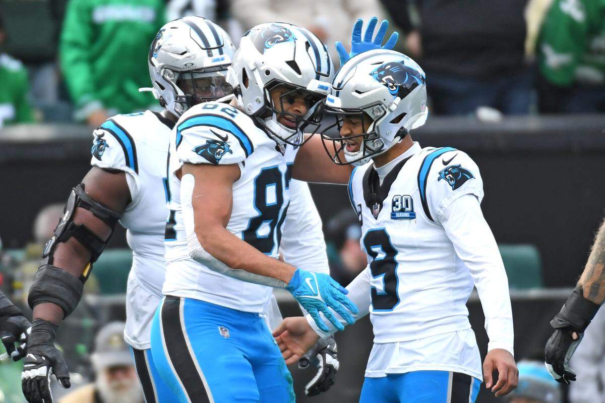Dec 8, 2024; Philadelphia, Pennsylvania, USA; Carolina Panthers tight end Tommy Tremble (82) celebrates his touchdown catch with quarterback Bryce Young (9) against the Philadelphia Eagles during the second quarter at Lincoln Financial Field. Mandatory Credit: Eric Hartline-Imagn Images