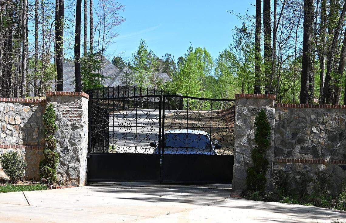 A security vehicle sits inside the gate at the home of Charlotte rapper DaBaby in Troutman, NC on April 15, 2022.