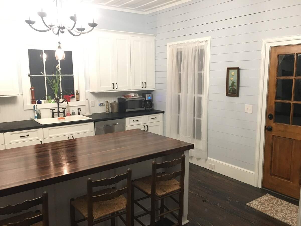 Inside, the renovated Sloan-Porter house boasts a beautiful farmhouse style and much of the original woodwork and brickwork.