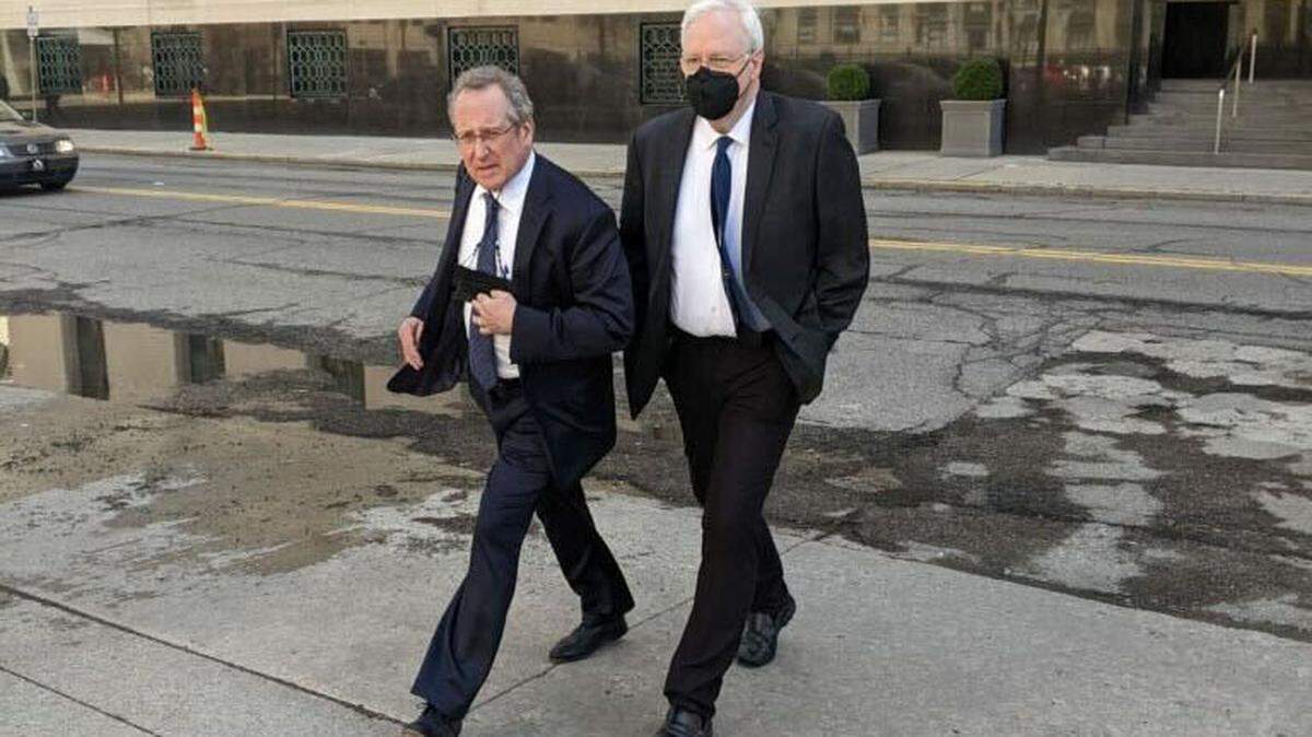 Stephen Shipps, right, and his attorney, John Shea, leave the federal courthouse in Detroit after Shipps was sentenced to five years in prison for trafficking an underage student for sex.
