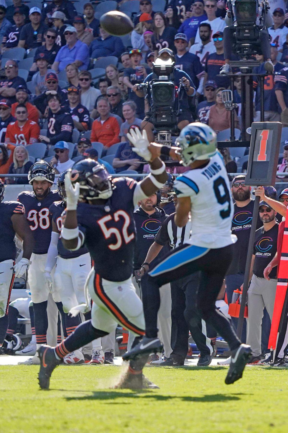 Chicago Bears defensive end Darrell Taylor (52) pressures Carolina Panthers quarterback Bryce Young (9) during Sunday’s second half at Soldier Field.