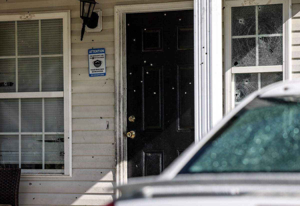 Bullet holes are seen on the door and window where Asiah Figueroa, 3, was killed as he slept in Charlotte, N.C., on Wednesday, September 8, 2021.
