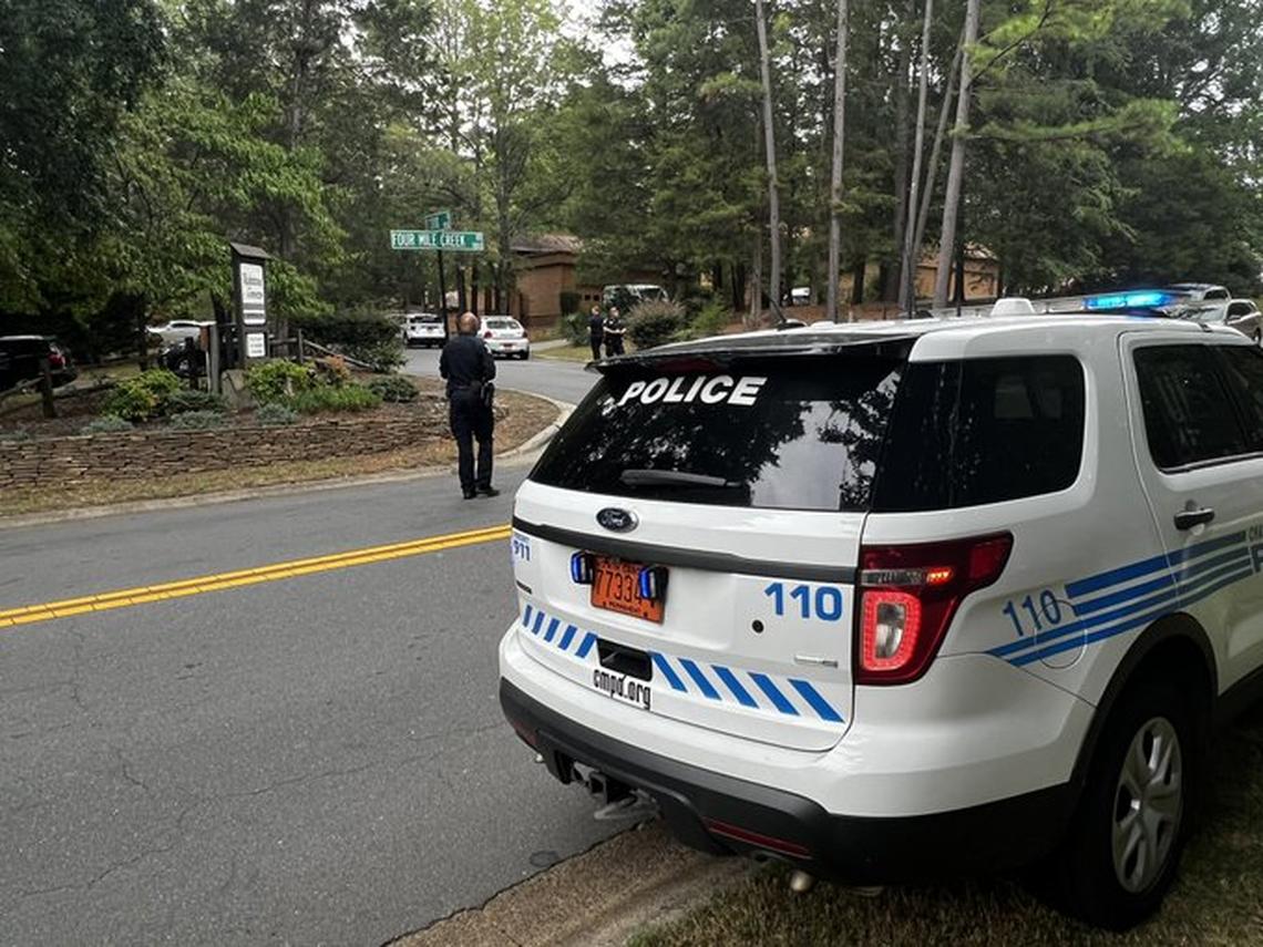 Charlotte-Mecklenburg police monitor the scene near a home in the 8900 block of St. La Croix Lane on Friday, Aug. 19, 2022. A woman fired a gun at three police officers, striking one in the chest, after they tried to serve an involuntary commitment order, CMPD said. The officer’s bulletproof vest stopped the bullet, police said.