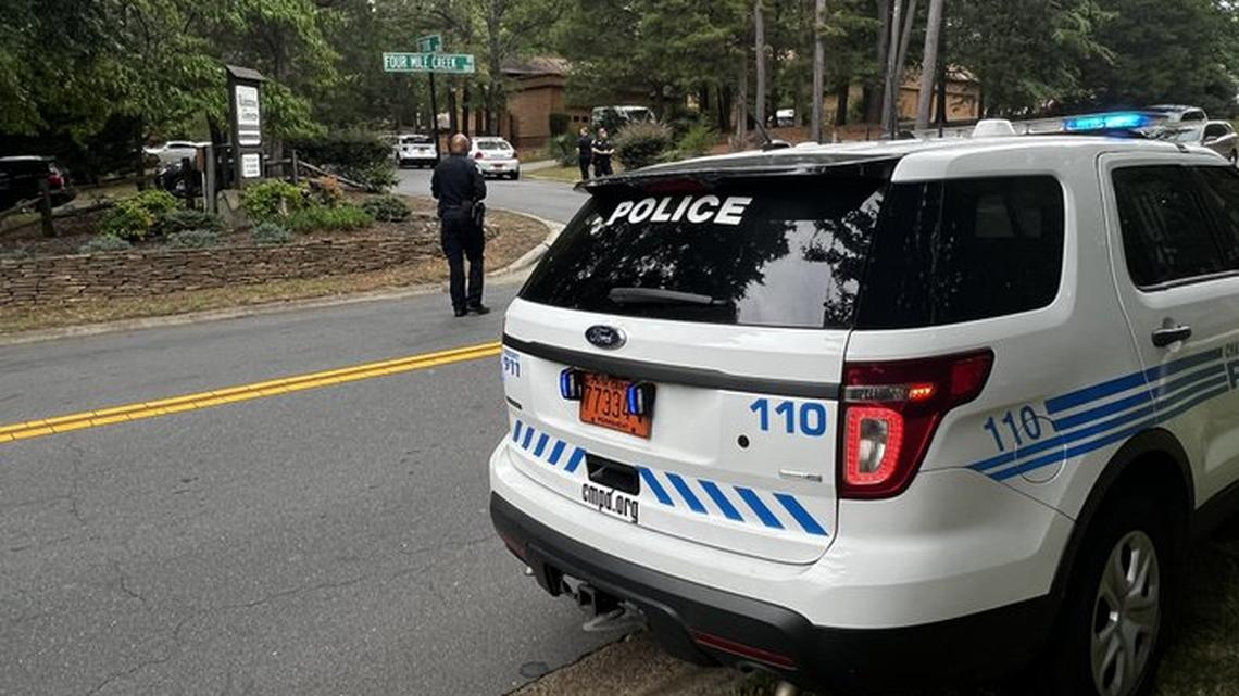 Charlotte-Mecklenburg police monitor the scene near a home in the 8900 block of St. La Croix Lane on Friday, Aug. 19, 2022. A woman fired a gun at three police officers, striking one in the chest, after they tried to serve an involuntary commitment order, CMPD said. The officer’s bulletproof vest stopped the bullet, police said.