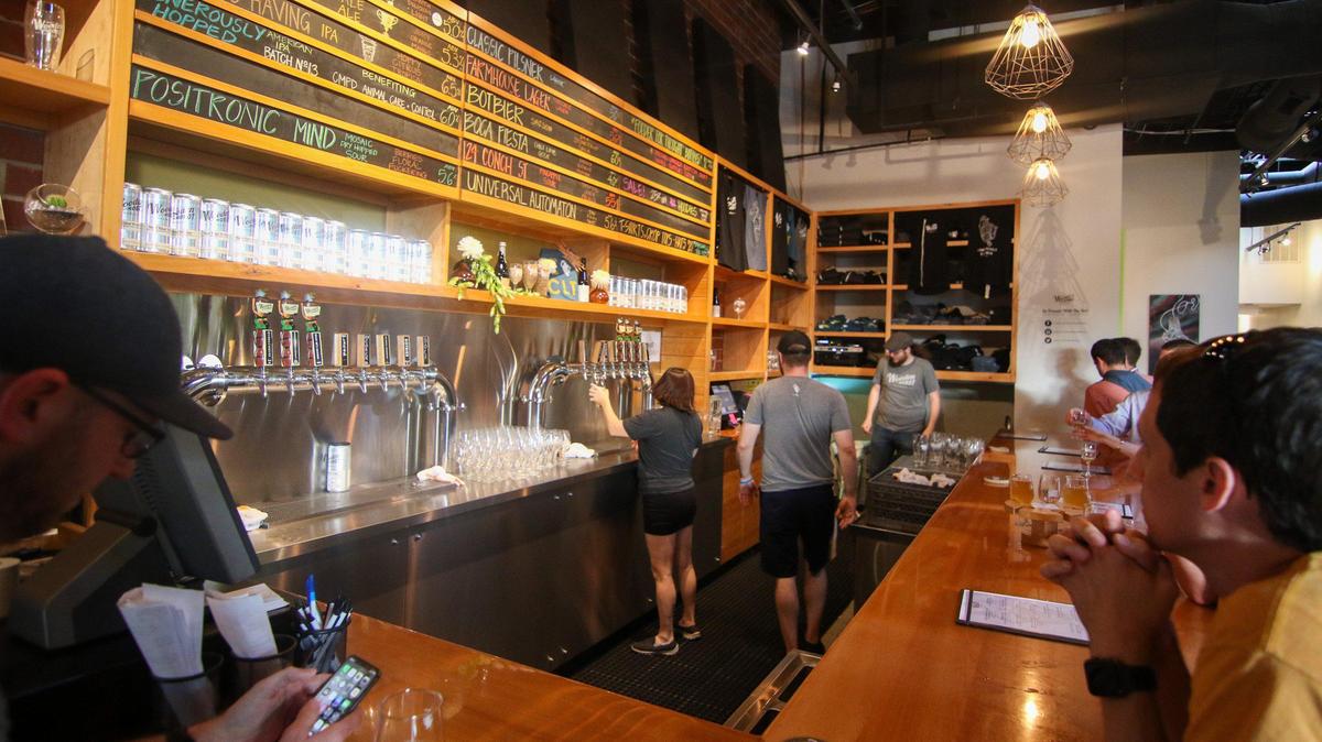Charlotte’s popular Wooden Robot Brewery will keep both its SouthEnd and NoDa locations closed this weekend, after an employee reported testing positive for COVID-19, brewery officials said.