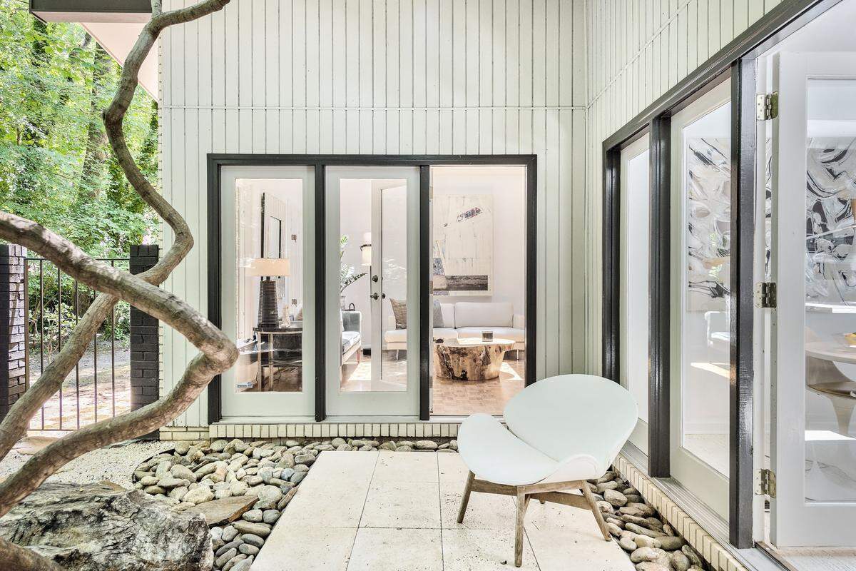The 1,959-square-foot house on Coatbridge Lane wraps around a courtyard filled with natural light.