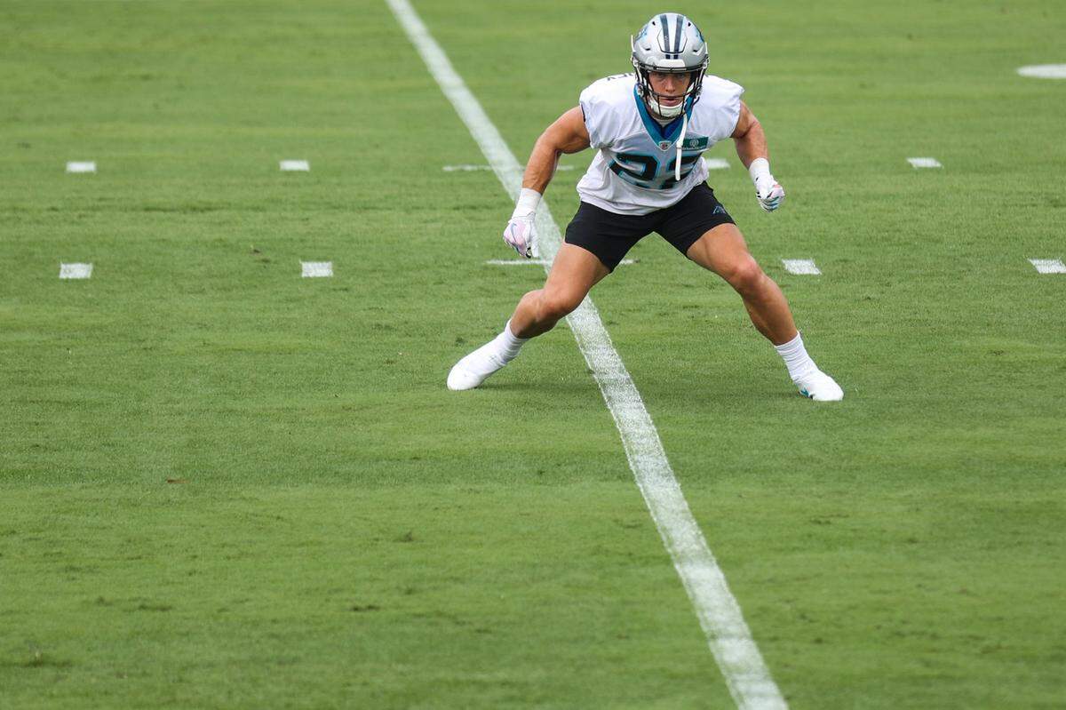 Panthers running back Christian McCaffrey warms up before the Back Together practice in Gibbs Stadium at Wofford College on Saturday, July 30, 2022 in Spartanburg, SC. 