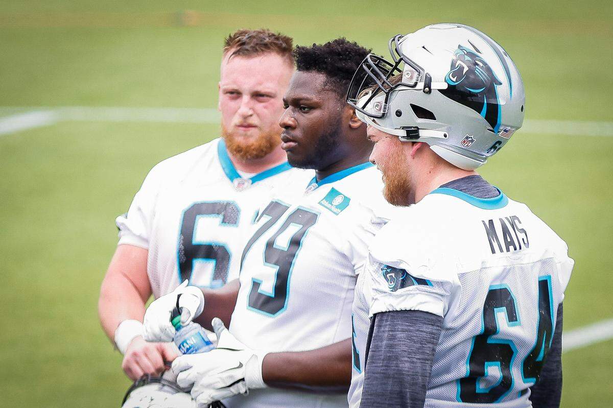 Carolina Panthers offensive lineman Hunter Kelly (61) tackle Ikem Ekwonu (79) and offensive lineman Cade Mays (64) on the field during rookie minicamp at the Panthers practice field in Charlotte, N.C., Friday, May 13, 2022.