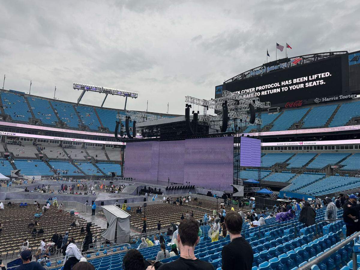 Bank of America Stadium signs announce fans can return to their seats after rain clears before the Kendrick Lamar and SZA concert on Saturday, May 3.