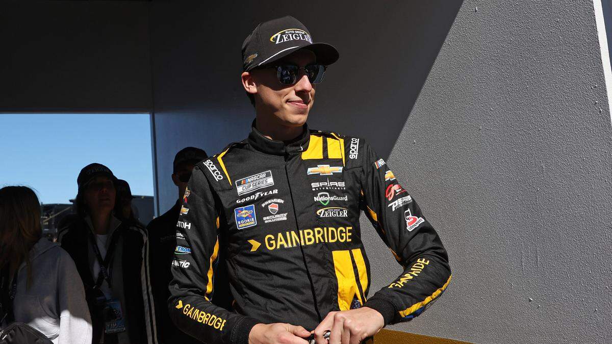 Feb 19, 2024; Daytona Beach, Florida, USA; NASCAR Cup Series driver Carson Hocevar (77) walks to the drivers meeting before the Daytona 500 at Daytona International Speedway.