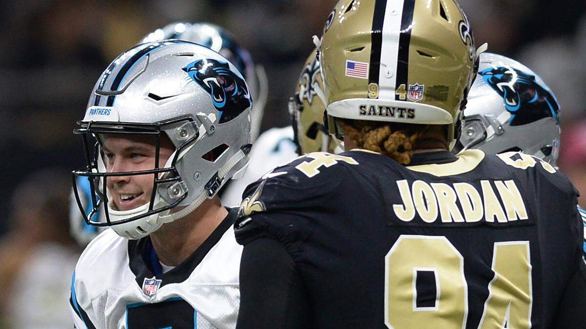 Carolina Panthers quarterback Kyle Allen smiles after diving into the end zone for a touchdown during first quarter action against the New Orleans Saints at the Mercedes-Benz Superdome in New Orleans, LA. on Sunday, December 30, 2018.