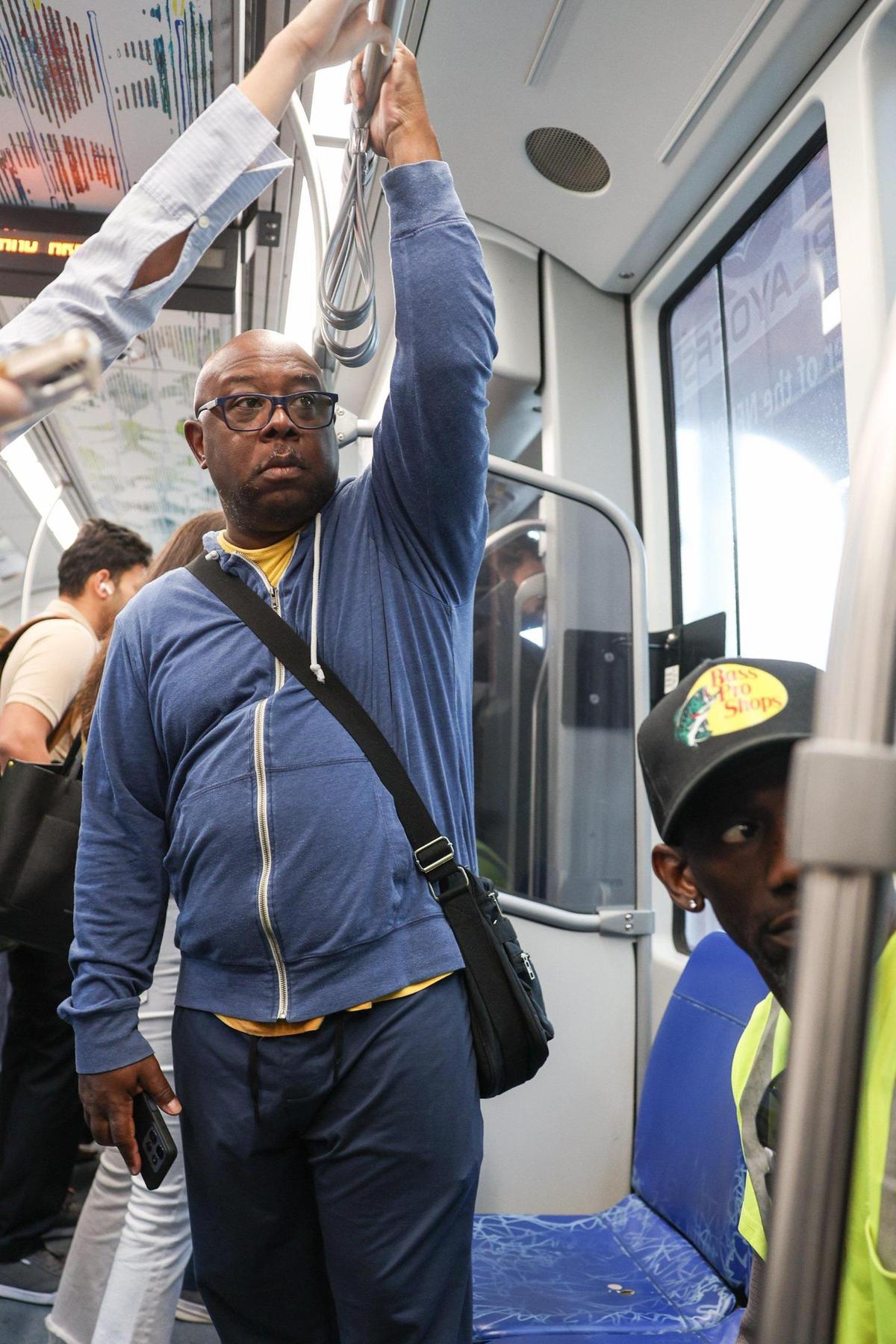 Garrick Combs, a volunteer at Saint Luke Missionary Baptist Church on Norris Avenue, rides the blue line as part of his daily routine.