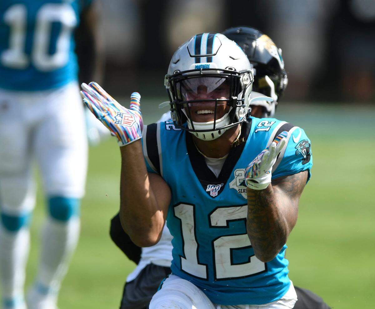 Carolina Panthers wide receiver D.J. Moore (12) celebrates his 52-yard reception Sunday in Carolina’s 34-27 win over Jacksonville.
