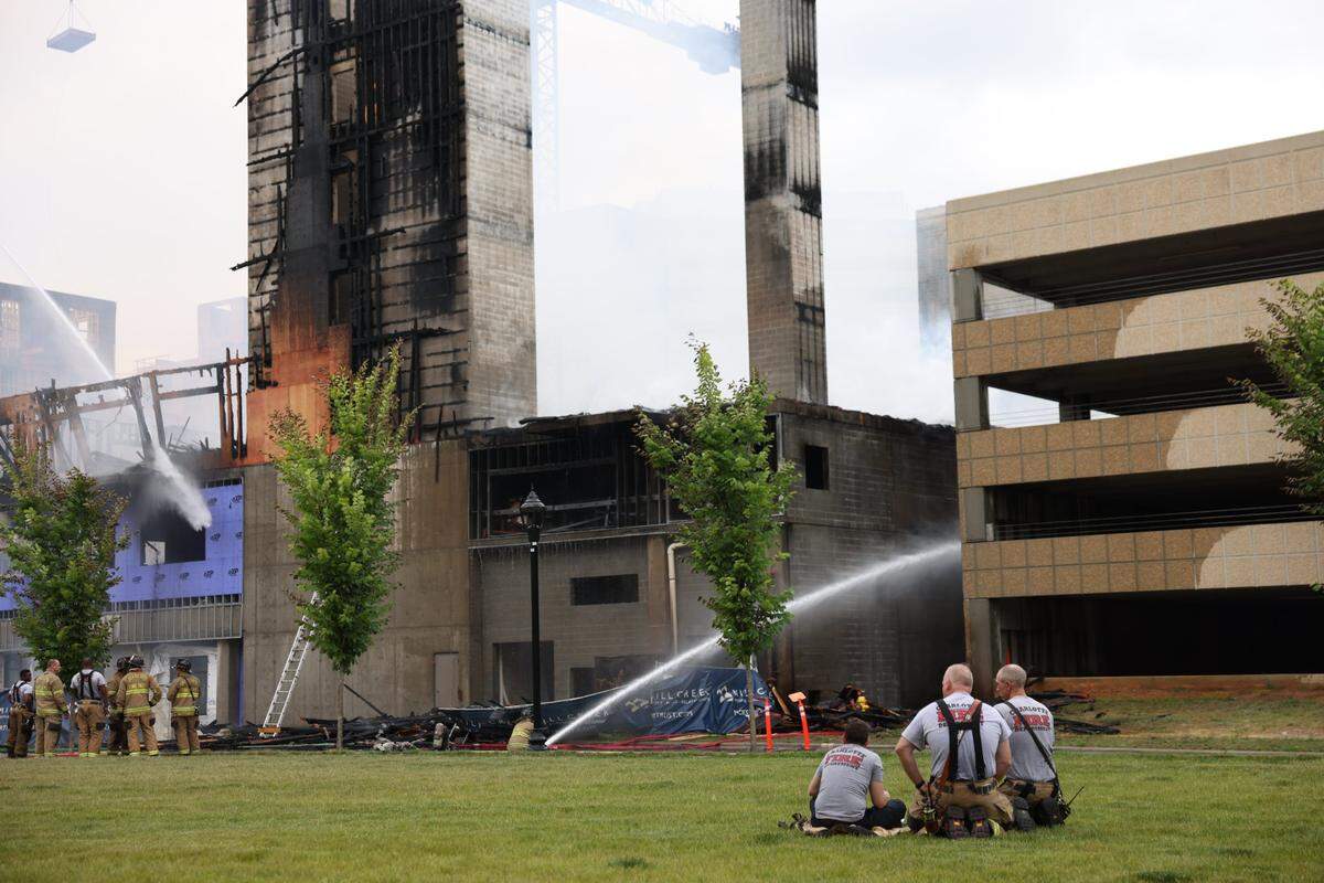 Firefighters continue working the scene of a massive fire spread across at least two structures and threatened others in Charlotte’s South Park neighborhood Thursday morning, May 18, 2023